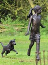 Girl running with terrier