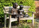 Bronze sculpture of children reading
